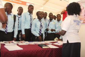 Students getting information from an exhibitor.