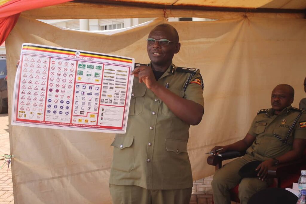 Director of traffic Niwabiine Lawrence engages boda-boda riders in Luuka to promote road safety